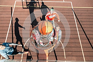 Top view of a ball falling into the basket photo