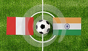 Top view ball with Peru vs. India flags match on green football field