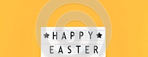 Top view banner Happy Easter text message ans greeting on a lightbox