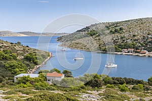 Top view of the bay with yachts and houses of the village near the island of Lavsa in the Adriatic sea in Croatia photo
