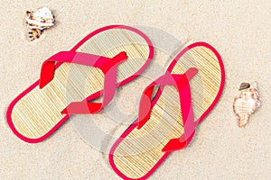 Top view beach flip flops sand