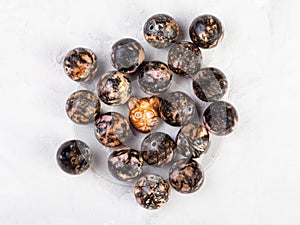 Top view of beads from natural rhodonite mineral