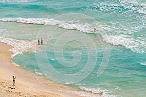 Top view of beautiful beach. Caribbean seaside beach with turquoise water and big waves. Tropical beach Cancun, the