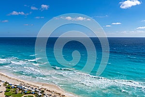 Top view of beautiful beach. Caribbean seaside beach with turquoise water and big waves. Tropical beach Cancun, the