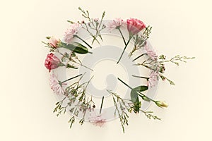 Top view of beautiful flowers arrangement on white wooden background. Copy space.