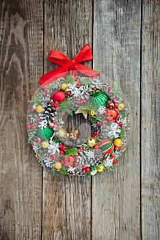 Top view Beautiful hand made bright Christmas wreath decorated with pine cones, spruce branches,berries, balls, stars and