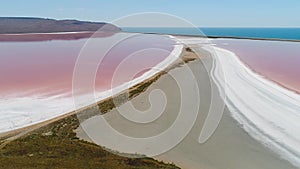 Top view of beautiful landscape with pink lake. Shot. Extraterrestrial miracle of nature-lake with pink water. Beautiful