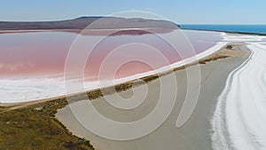 Top view of beautiful landscape with pink lake. Shot. Extraterrestrial miracle of nature-lake with pink water. Beautiful