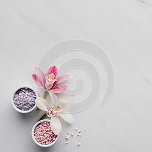 top view of beautiful orchid flowers and sea salt in bowls