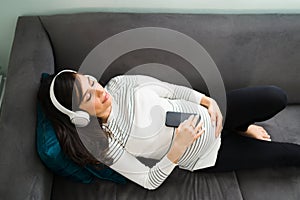 Top view of a beautiful pregnant woman meditating