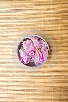 Top View of Beautiful Rose Flower Petals in Water in small bowl