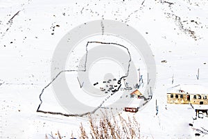 Top view beautiful scenery of farmimg community covered with snow in winter season