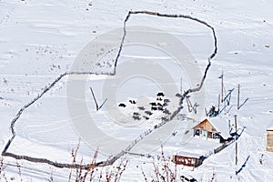 Top view beautiful scenery of farmimg community covered with snow in winter season