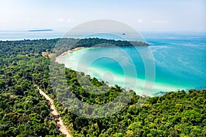 Top view of a beautiful tropical island with dense forest or jungle. long beach in tropical paradise snake island near photo