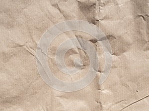 Top view beige crumpled wrapping paper background texture