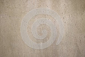 Top view of beige textured rough concrete stone background.