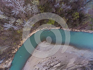 Top view on the bend of the river, forest and beach