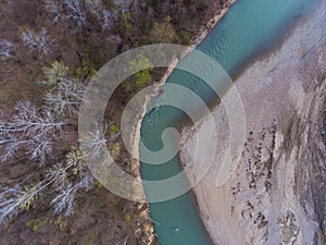 Top view on the bend of the river, forest and beach