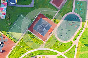 Top view, bird eye view of residential area with sports grounds courts