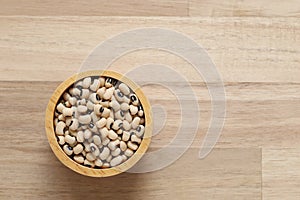 Top view of Black eyed beans in a bowl on wooder background, Healthy eating concept