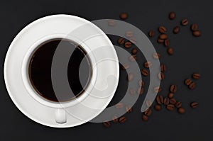 Top view of black hot coffee With a white ceramic cup.