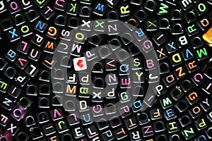 Black Plastic dice, cubes with letters image photo