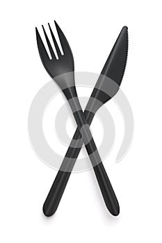 Top view of  black plastic disposable fork and knife
