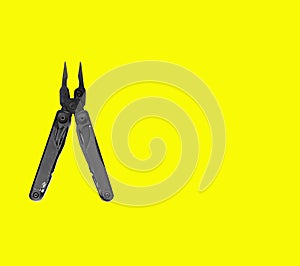 Top view of black pliers of  multi tool   on white backround with empty space. Business and craft concept
