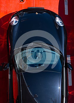 Top view of a black Porsche 911 sports car..