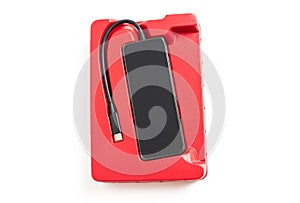 Top view of a black usb-c hub in red box on white