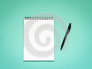 Top view of blank note paper with pen