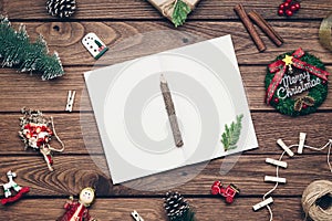 Top view of blank notebook on wood  background with xmas decorations. Mockup Christmas background with notebook for wish list or t