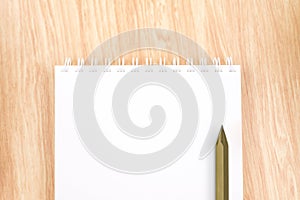 Top view of blank open ring binder notebook with black pencil o