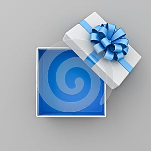 Top view of blank open white gift box with blue bottom inside or opened blue present box with blue ribbon and bow