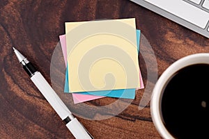 Blank sticky adhesive note with a cup of coffee