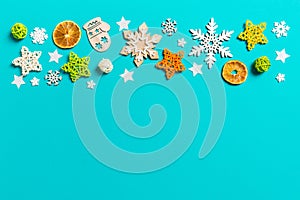 Top view of blue background with New Year toys and decorations. Christmas time concept with copy space