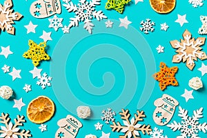 Top view of blue background with New Year toys and decorations. Christmas time concept with copy space