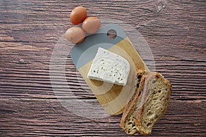 top view of blue cheese ,and slice of brown bread on table