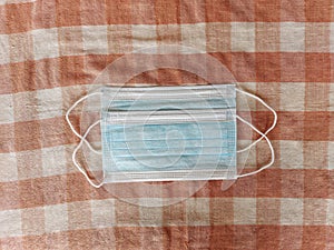 Top view blue disposable medical mask to avoid virus