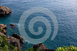 Top view of blue frothy sea surface. Shot in the open sea from above.