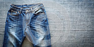 Top View of Blue Jeans on Plain Background