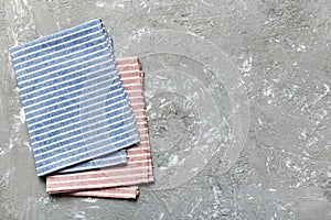 top view with blue kitchen napkin isolated on table background. Folded cloth for mockup with copy space, Flat lay