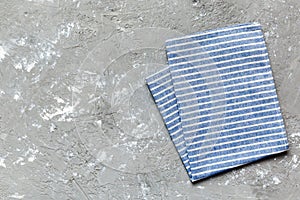 top view with blue kitchen napkin isolated on table background. Folded cloth for mockup with copy space, Flat lay