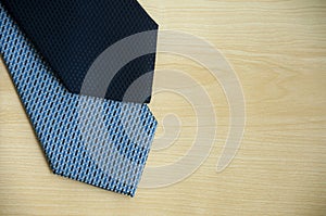 Top view of blue neckties on wooden background. Copy space and idea concept