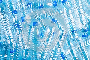 Top view of blue plastic bottles background. Recycle concept