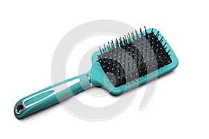 Top view of blue plastic hairbrush isolated on white