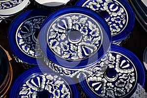 Top view of blue pots with closures in Asian style, handmade ceramics with traditional patterns