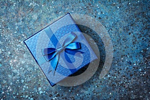 Blue gift box with shiny satin bow