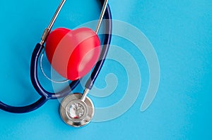 Top view blue stethoscope on blue sky background. health background