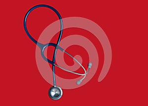 Top view blue stethoscope on red background. For check heart or health check up concept